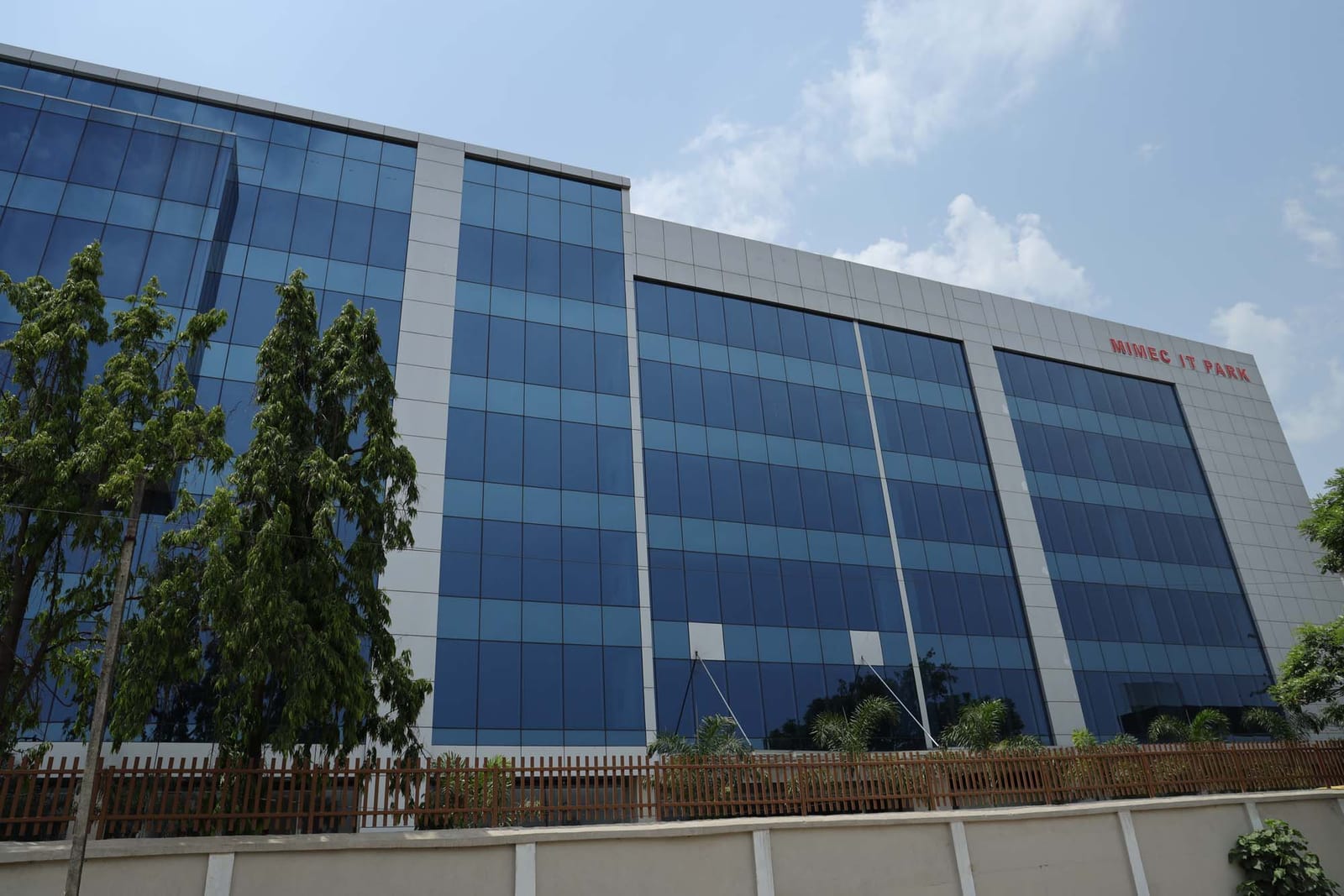 Blue glass curtain wall facade of Mimec IT Park
