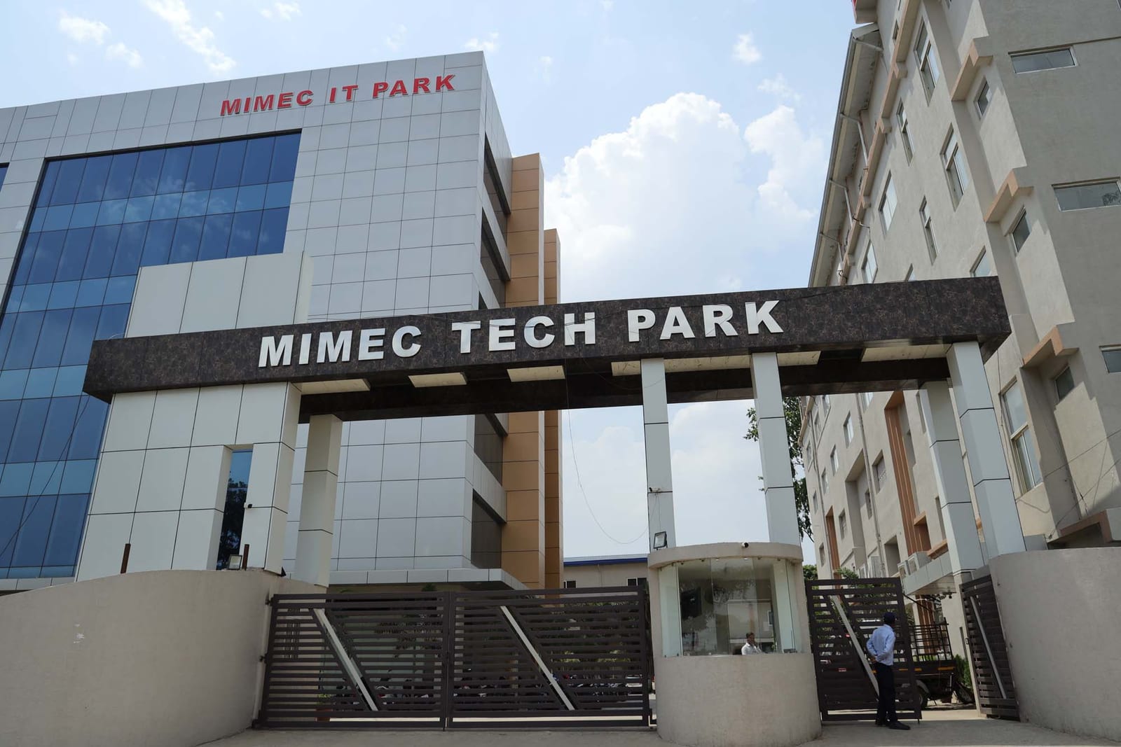 Gate entrance with MIMEC TECH PARK signage
