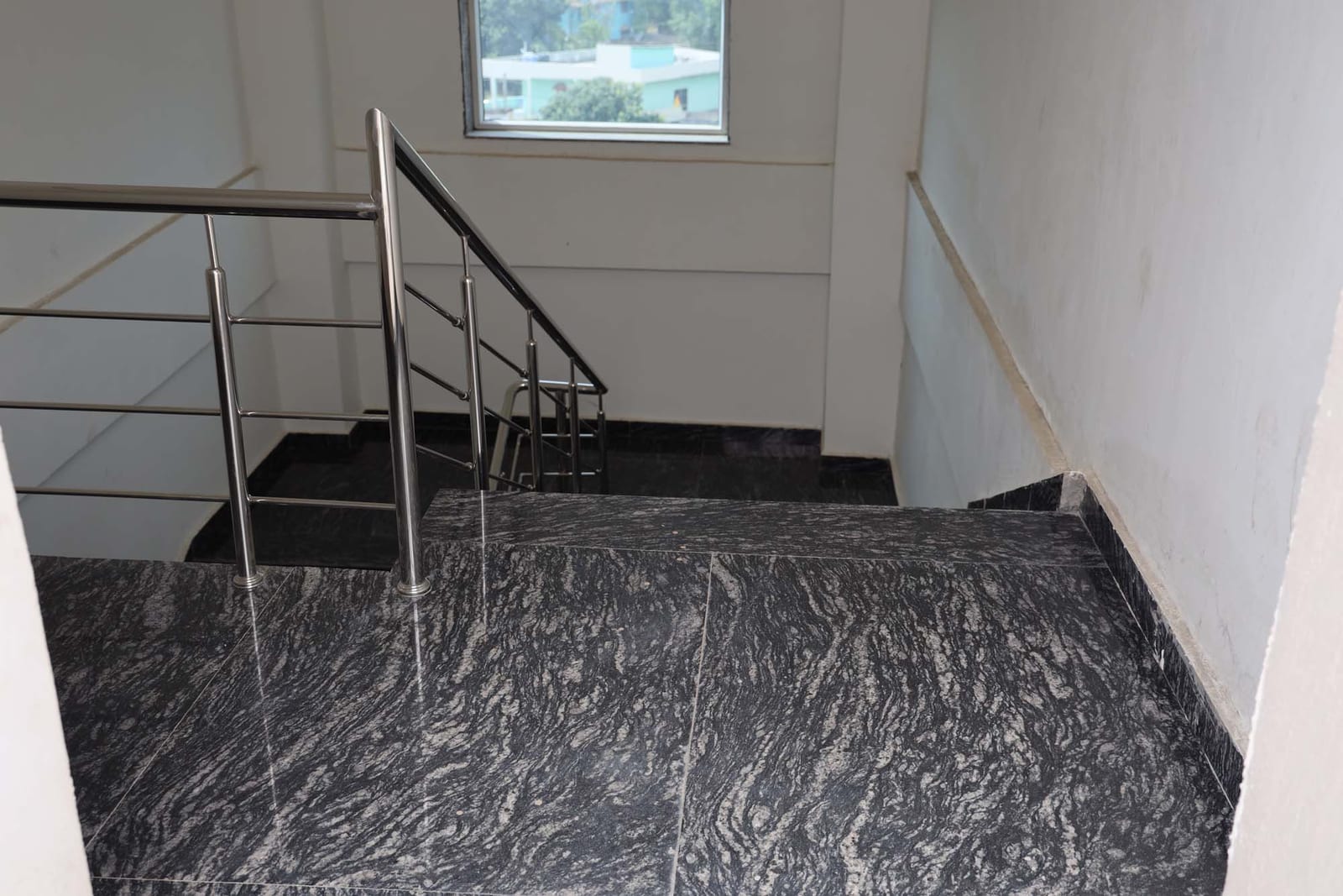 Granite staircase with steel railings